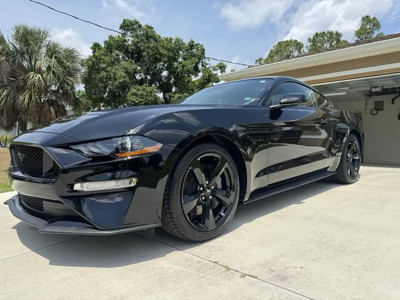 Black Ford Mustang with a fresh ceramic coating
