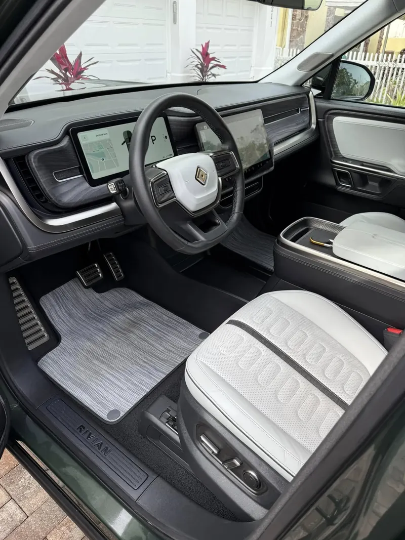 Clean Rivian interior with white seats after an interior detail